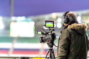 Our Blogs 3 professional video camera broadcasting a football match. High quality photo