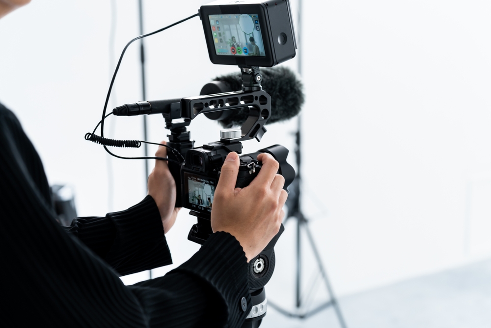 10 Reasons to Hire a Photographer for Your Next Event 1 Young,Photographer,Taking,A,Picture