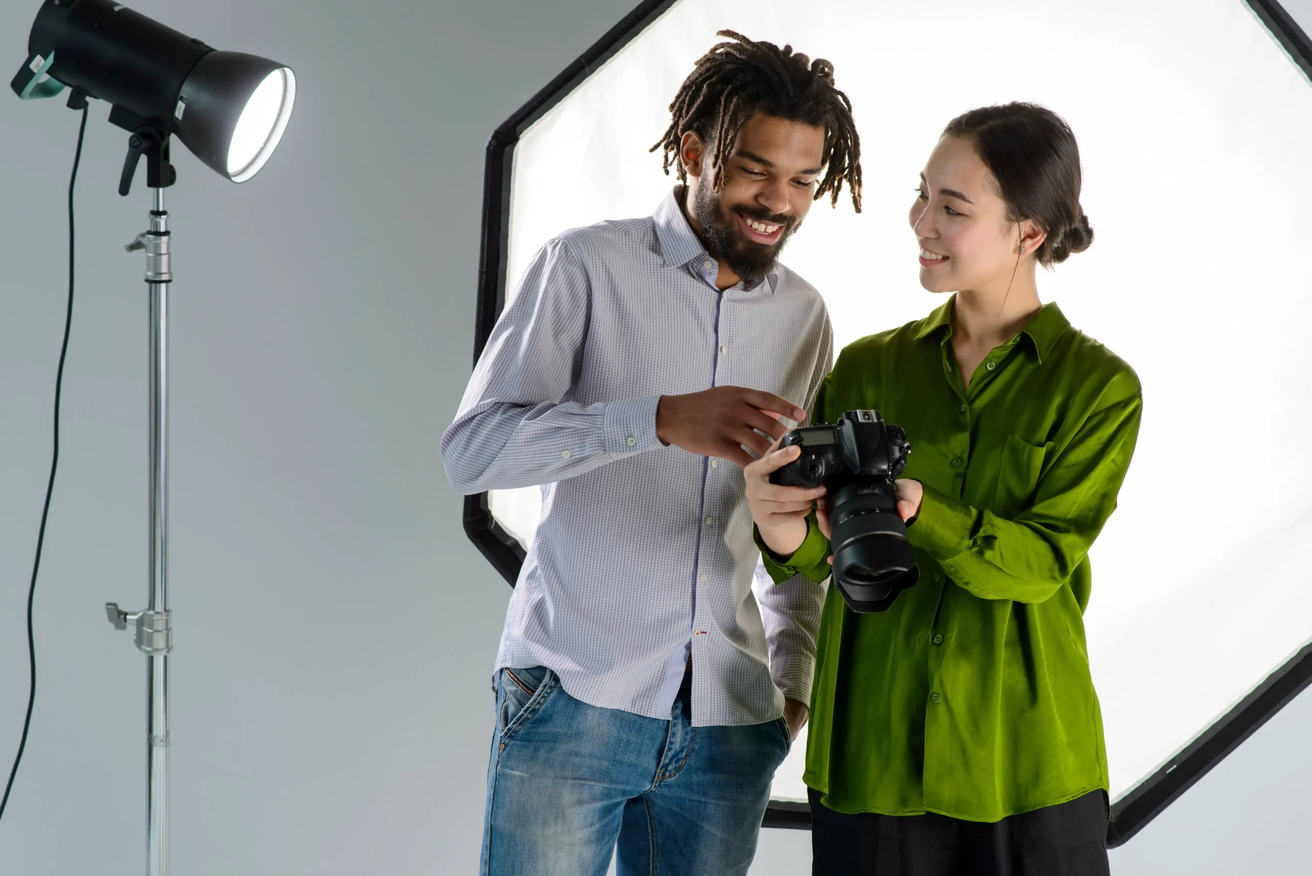 men-women-happy-in-studio-video-production-shooting-set