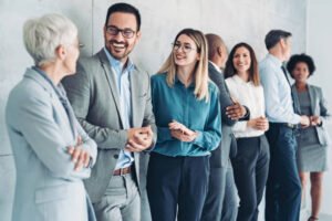 Our Blogs 12 Multi-ethnic group of people in formal businesswear standing in a row