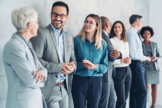 Corporate Event Planning Made Easy: Complete Guide for Businesses 3 Multi-ethnic group of people in formal businesswear standing in a row